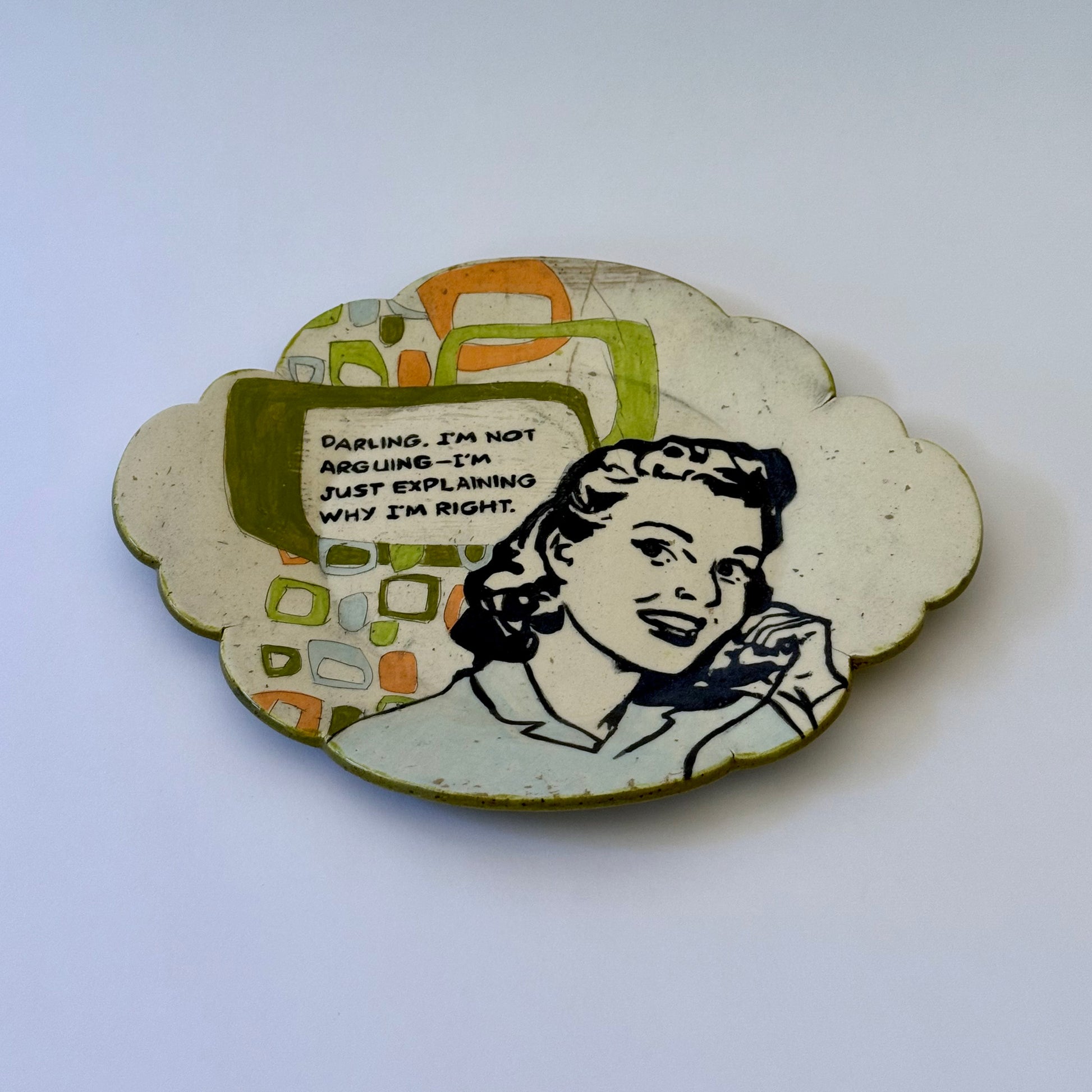 Decorative plate with a vintage-style illustration of a woman and text on a white background