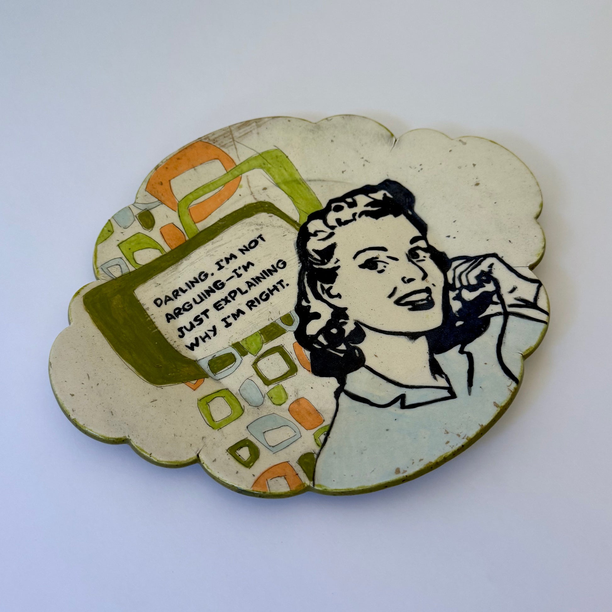 Decorative plate with a vintage-style illustration of a woman and text on a white background