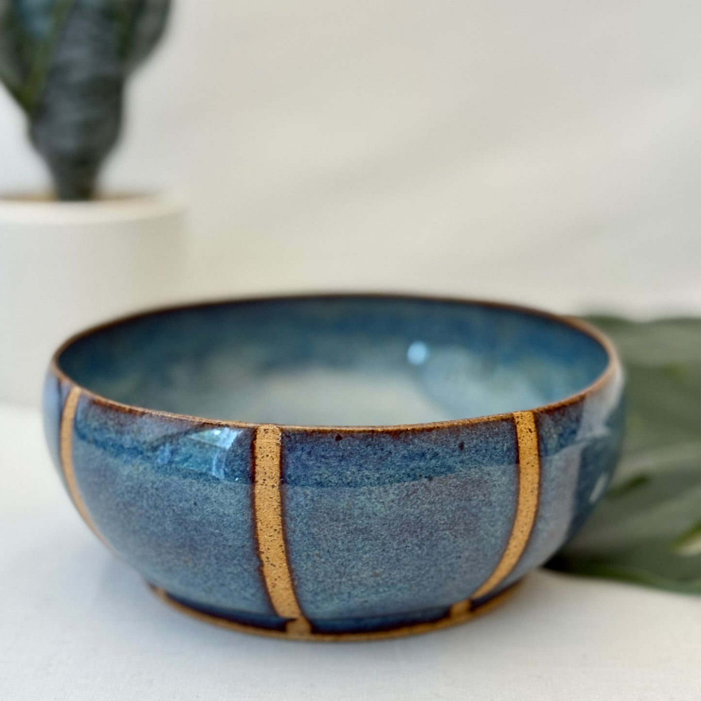 Blue ceramic bowl with natural clay accents