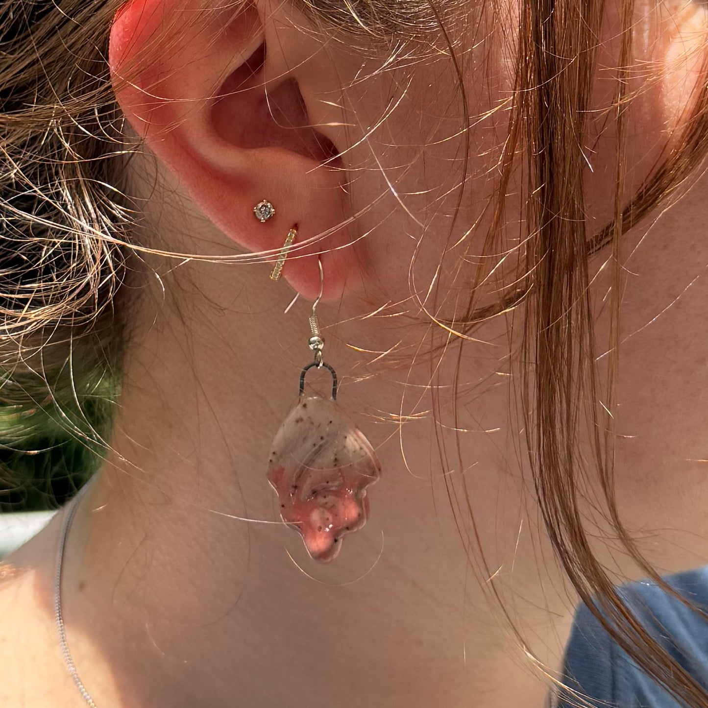 Close-up of a person wearing earrings