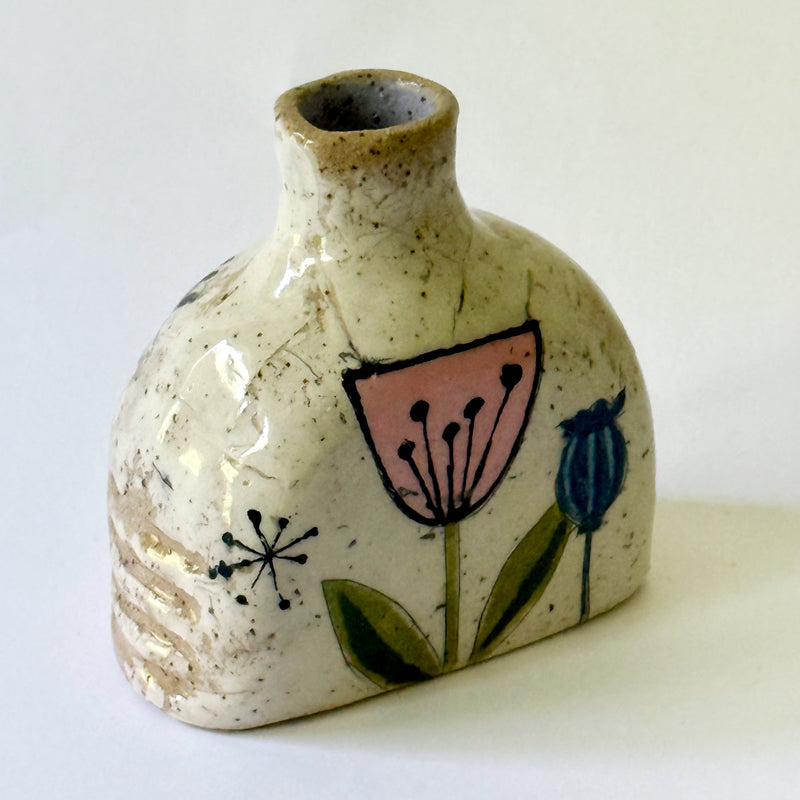 Small handbuilt speckled stoneware vase with colorful mid-century-inspired floral and botanical monoprints,