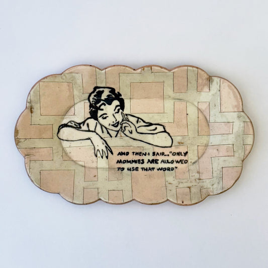 Decorative plate with a vintage-style illustration of a woman and text on a white background