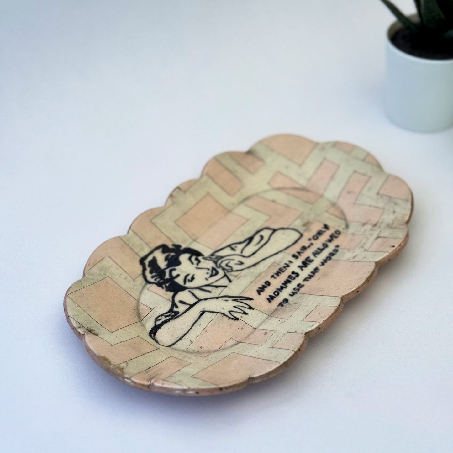 Decorative plate with a vintage-style illustration of a woman and text on a white background