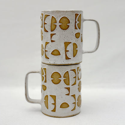 Ceramic mugs with geometric pattern on a white background