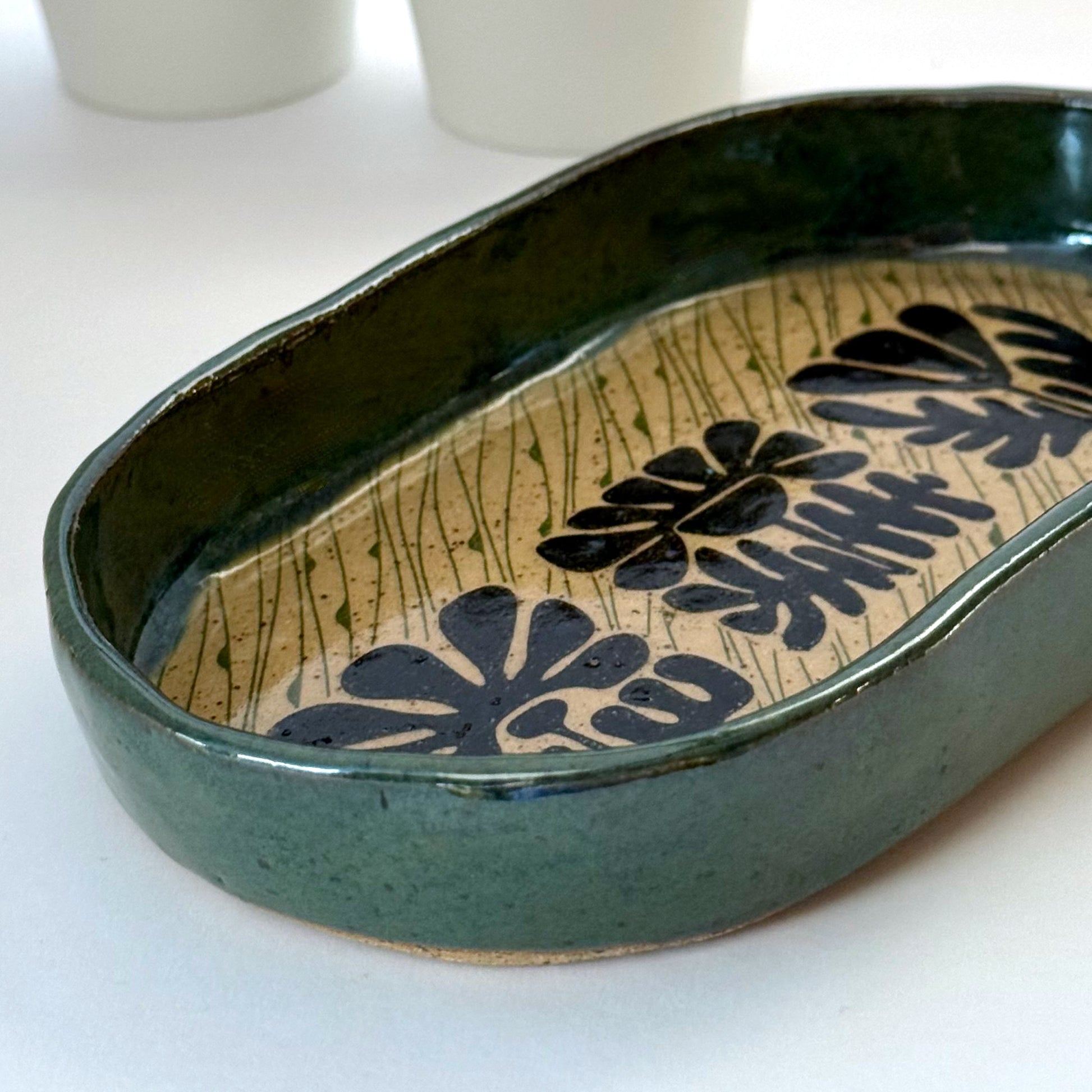 Ceramic dish with floral patterns on a white background