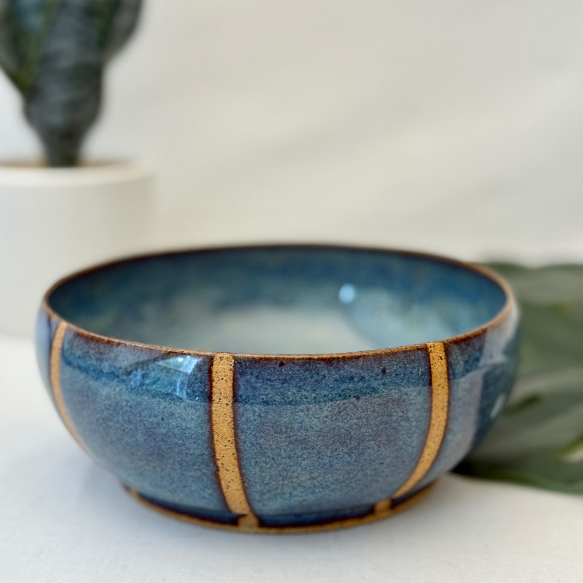 Blue ceramic bowl with natural clay accents