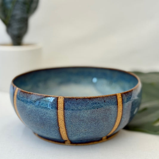 Blue ceramic bowl with natural clay accents