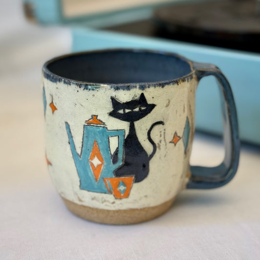 Stoneware mug featuring black cat and retro coffee pot in orange and blue