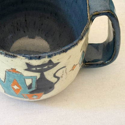 Stoneware mug featuring black cat and retro coffee pot in orange and blue