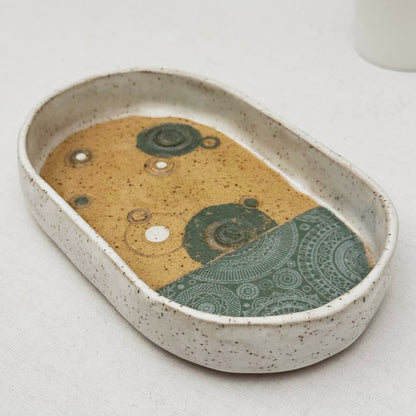 oval circle themed ceramic tray on a light background