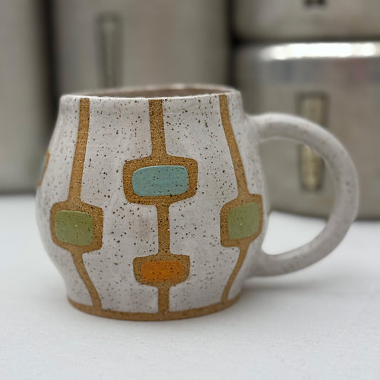 white ceramic mug with groovy grid pattern