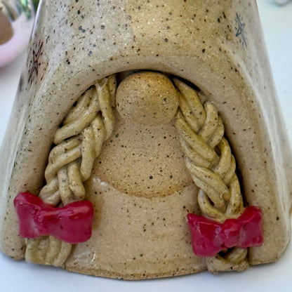 ceramic gnome with braids and red bows 