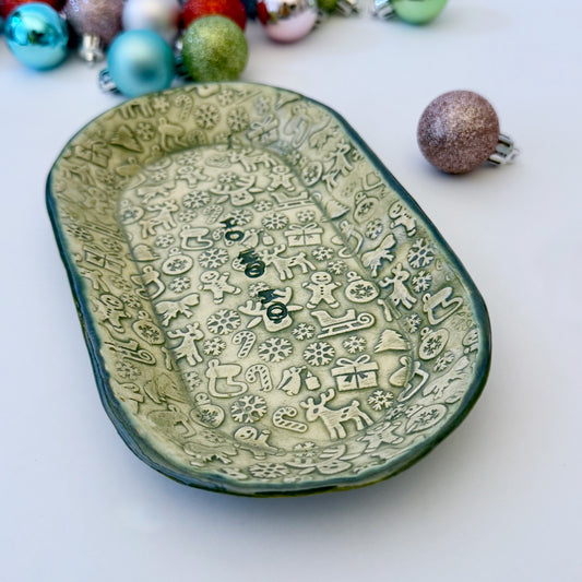 green and ivory ceramic oval plate with "ho ho ho"