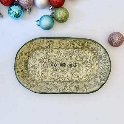 green and ivory ceramic oval plate with "ho ho ho"