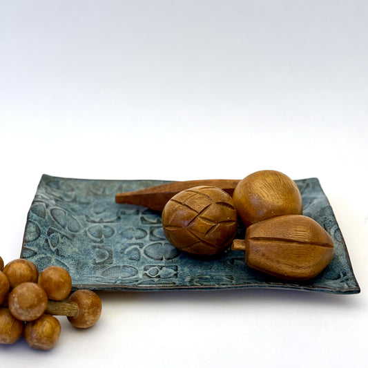 Rectangular hand built stoneware tray with an impressed repeating mid century inspired pattern and layered blue glaze.