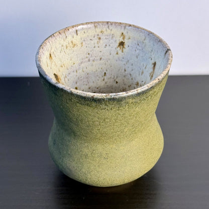 Handmade Olive Cinch Vase with a softly pinched hourglass silhouette, rounded lower body, and matte olive-green glaze with subtle darker variation near the rim and sides.