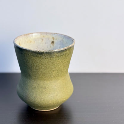 Handmade Olive Cinch Vase with a softly pinched hourglass silhouette, rounded lower body, and matte olive-green glaze with subtle darker variation near the rim and sides.