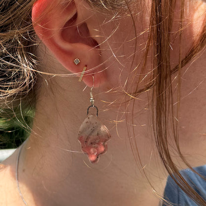 Close-up of a person wearing earrings