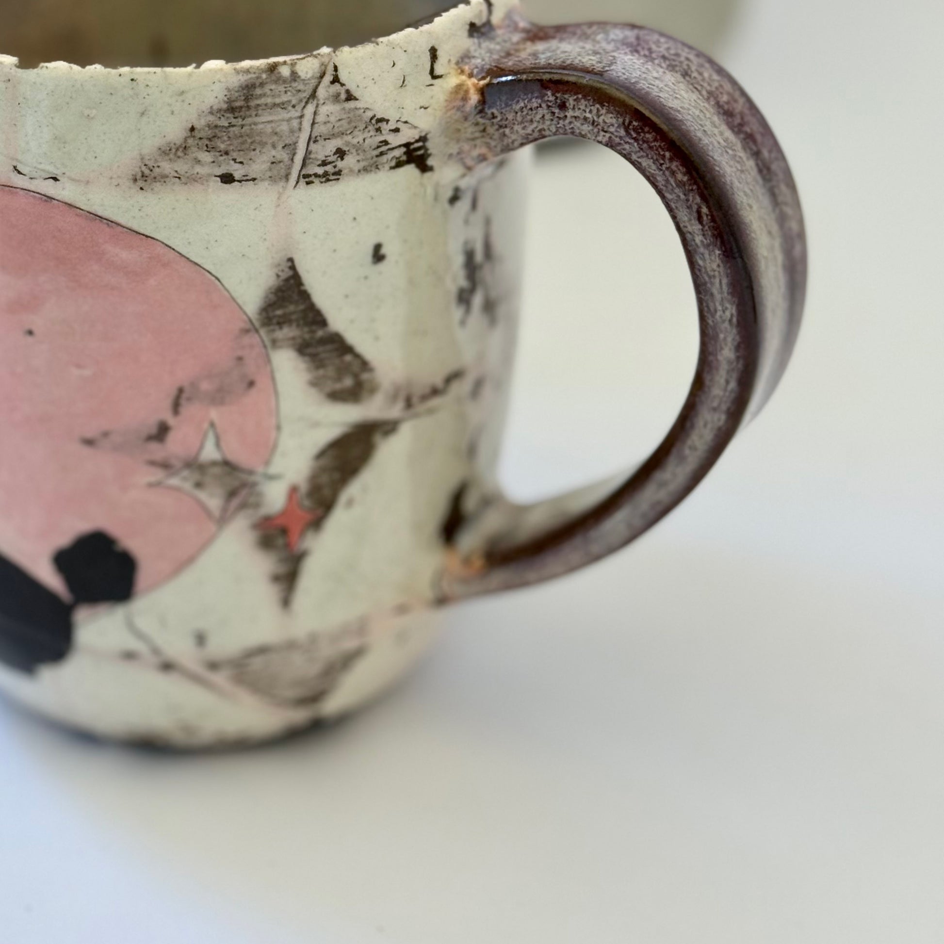 Pink-and-white ceramic mug featuring a black retro poodle silhouette against a pink circle.