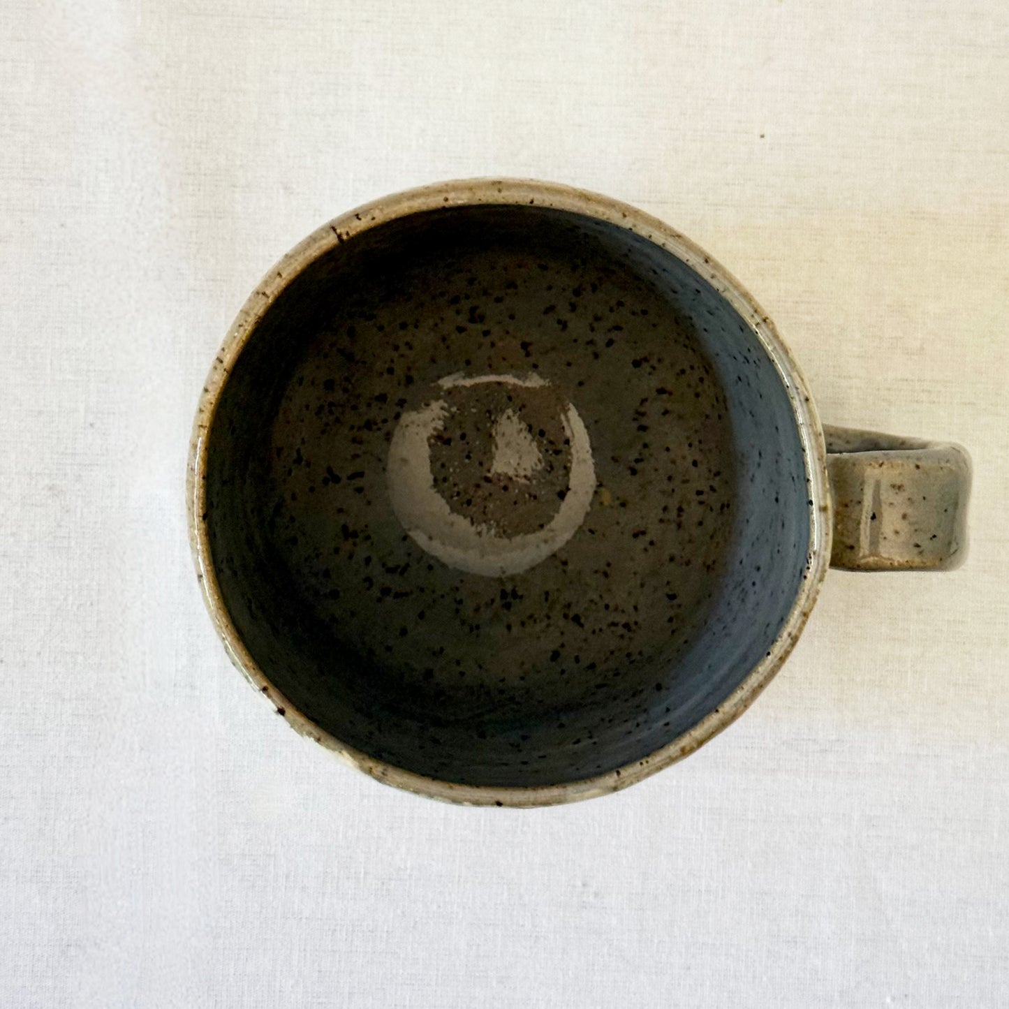 Ceramic mug with mid century design on a white surface