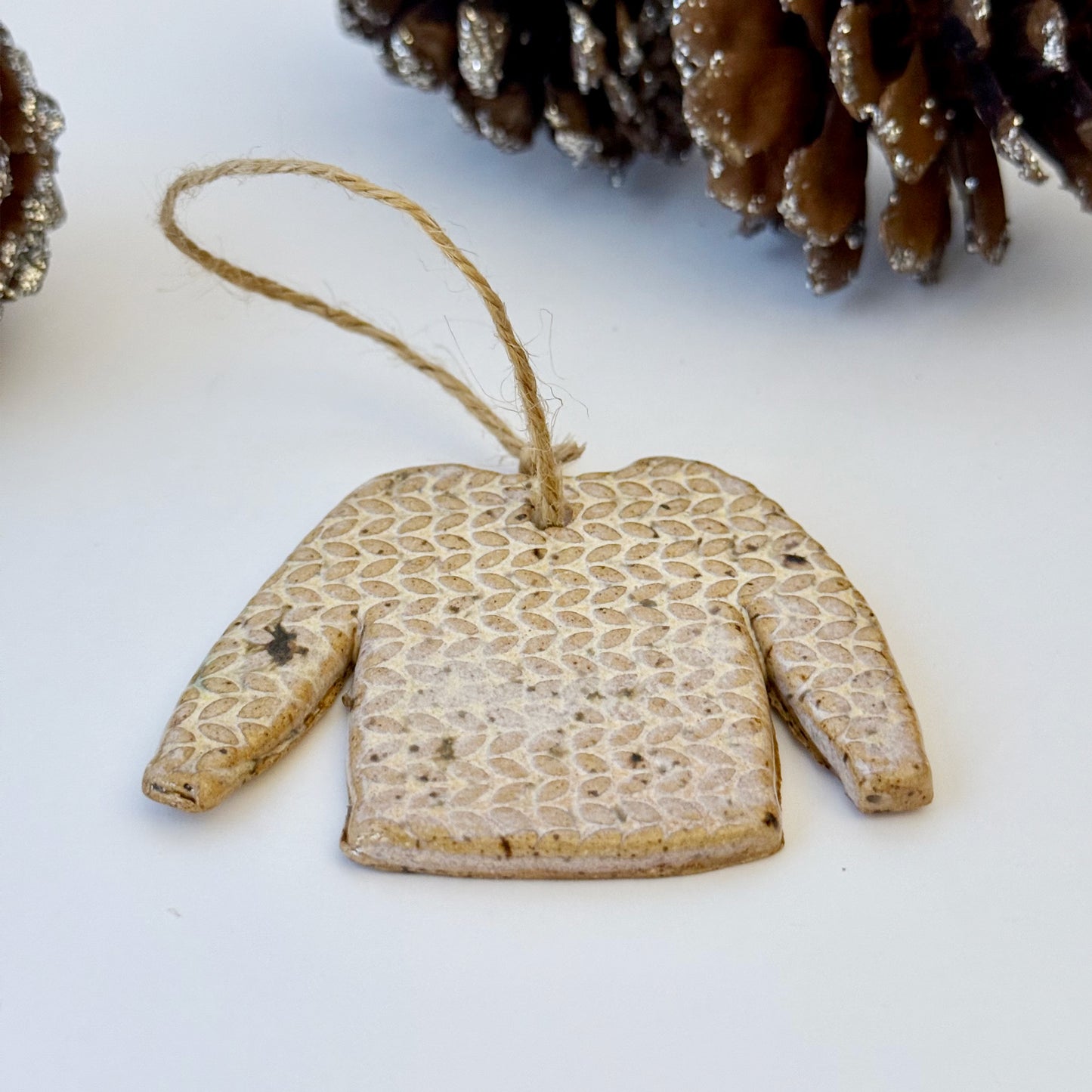 ceramic sweater ornament with texture