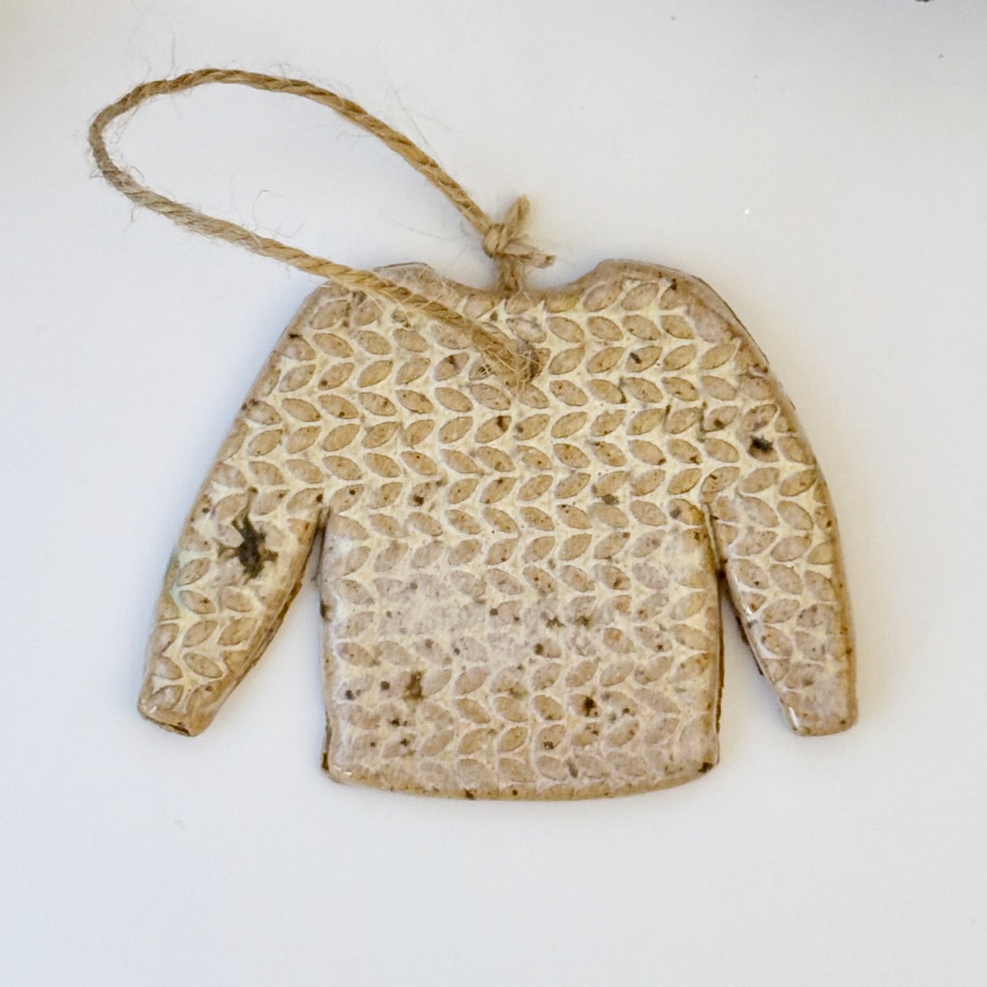 ceramic sweater ornament with texture