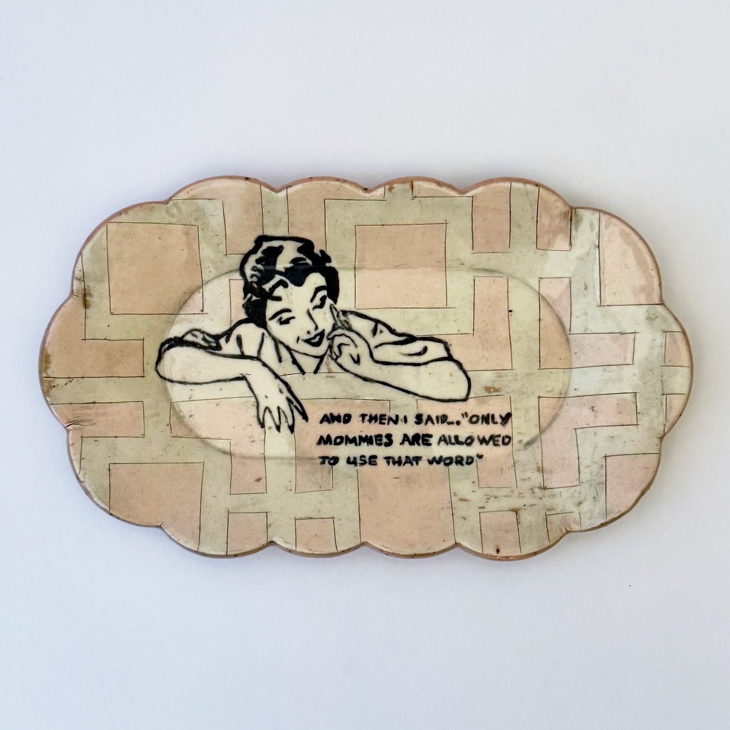 Decorative plate with a vintage-style illustration of a woman and text on a white background