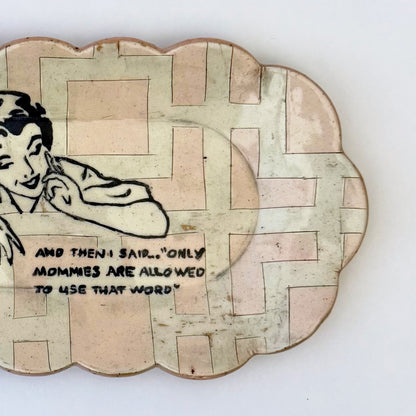 Decorative plate with a vintage-style illustration of a woman and text on a white background