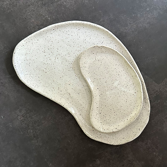 small and large lima bean shaped plates