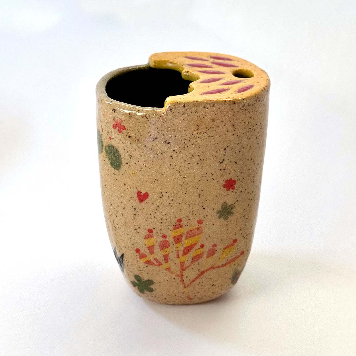 Ceramic to go mug with a black cat design on a white background