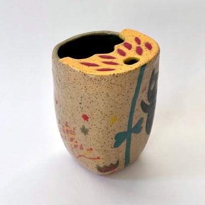 Ceramic to go mug with a black cat design on a white background