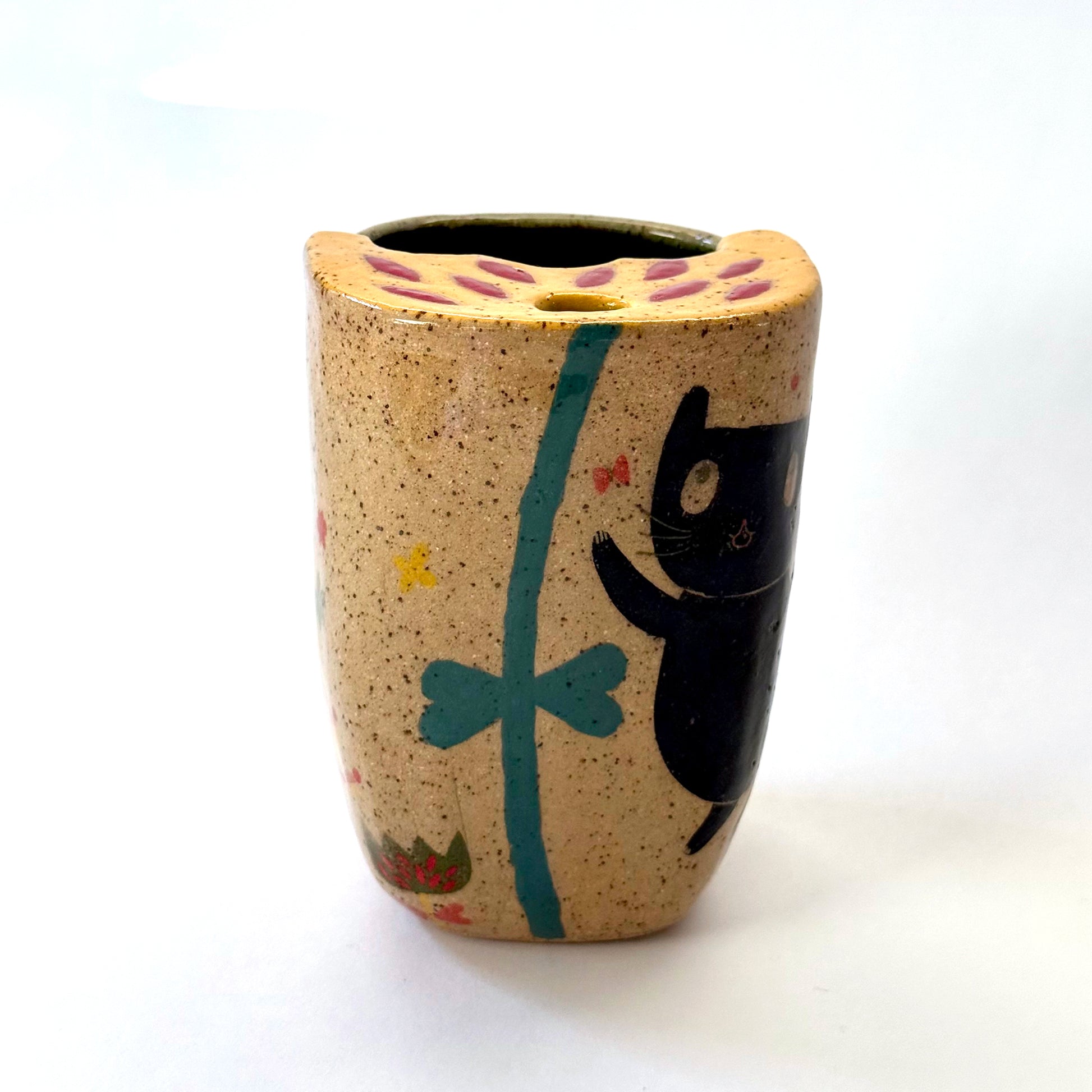 Ceramic to go mug with a black cat design on a white background